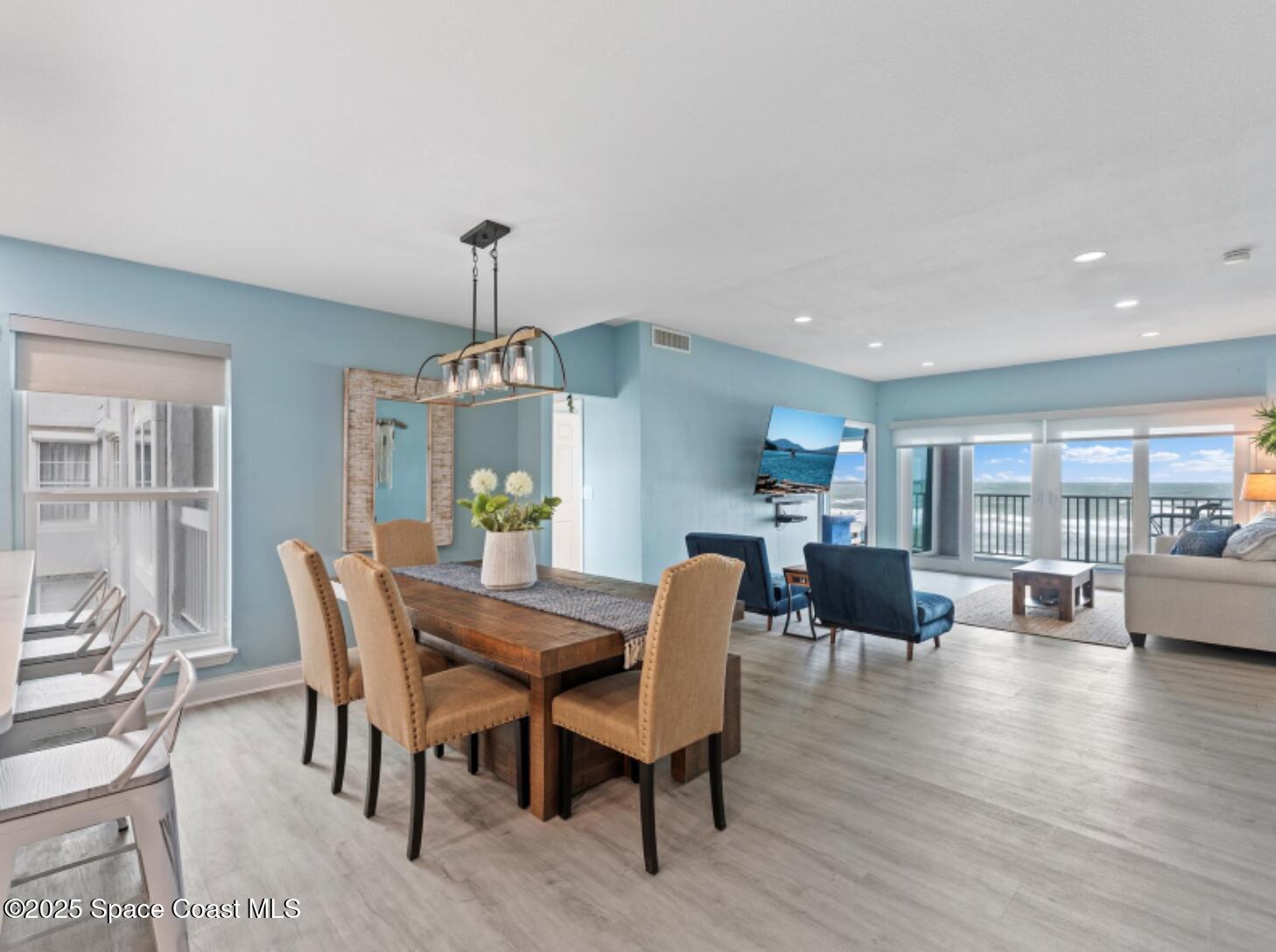 3037 S Highway, Unit 2C Melbourne Beach, FL 32951 - Photo 9 of 48 a view of a dining room with furniture window and wooden floor