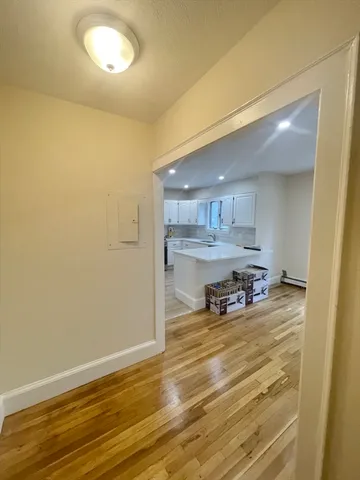a view of a room with kitchen island and a sink