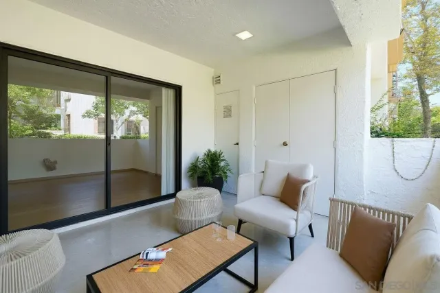 a view of a house with swimming pool and a small yard