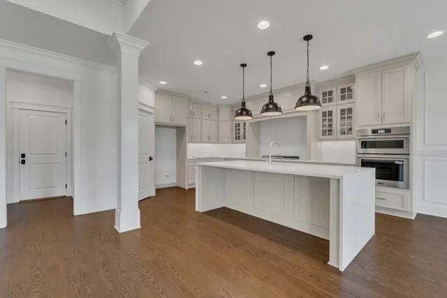 a kitchen with cabinets and window