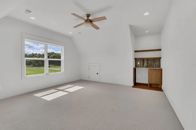 a view of an empty room with a window