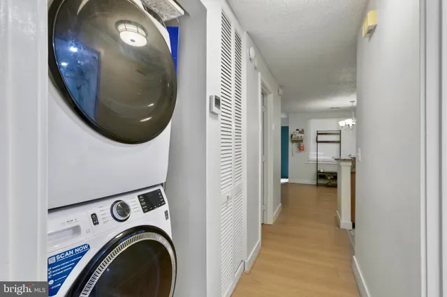 a view of a hallway with washer and dryer