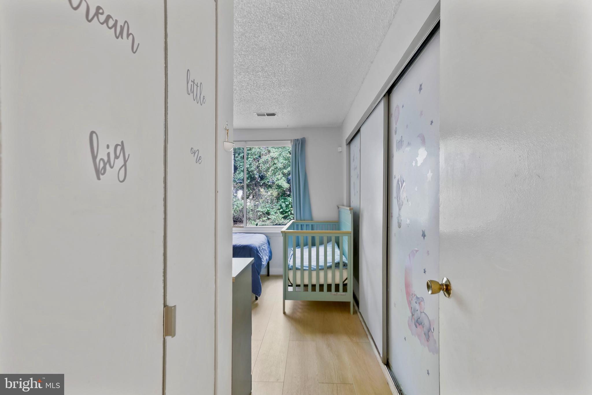 11723 Summerchase Circle Reston, VA 20194 - Photo 14 of 22 a view of a hallway with a door and furniture
