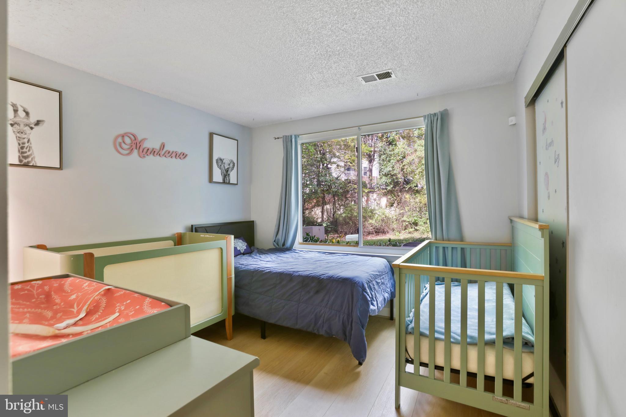 11723 Summerchase Circle Reston, VA 20194 - Photo 15 of 22 a bedroom with a bed and window