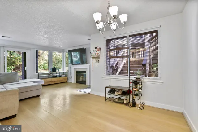 a view of a livingroom with furniture and a window