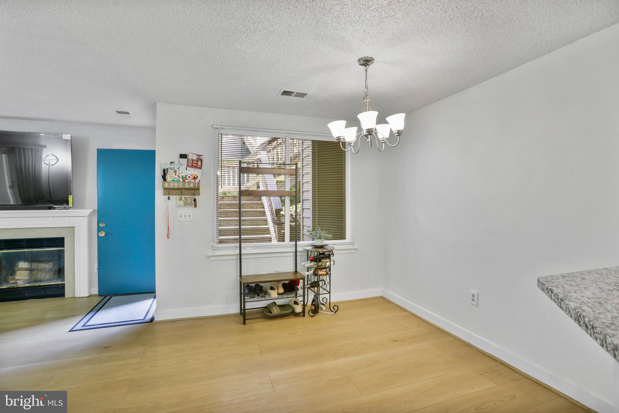 11723 Summerchase Circle Reston, VA 20194 - Photo 7 of 22 a view of a room with chandelier and livingroom