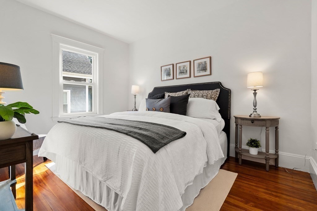 2 Glover Street, Unit 1 Salem, MA 01970 - Photo 20 of 38 a spacious bedroom with a bed and a table