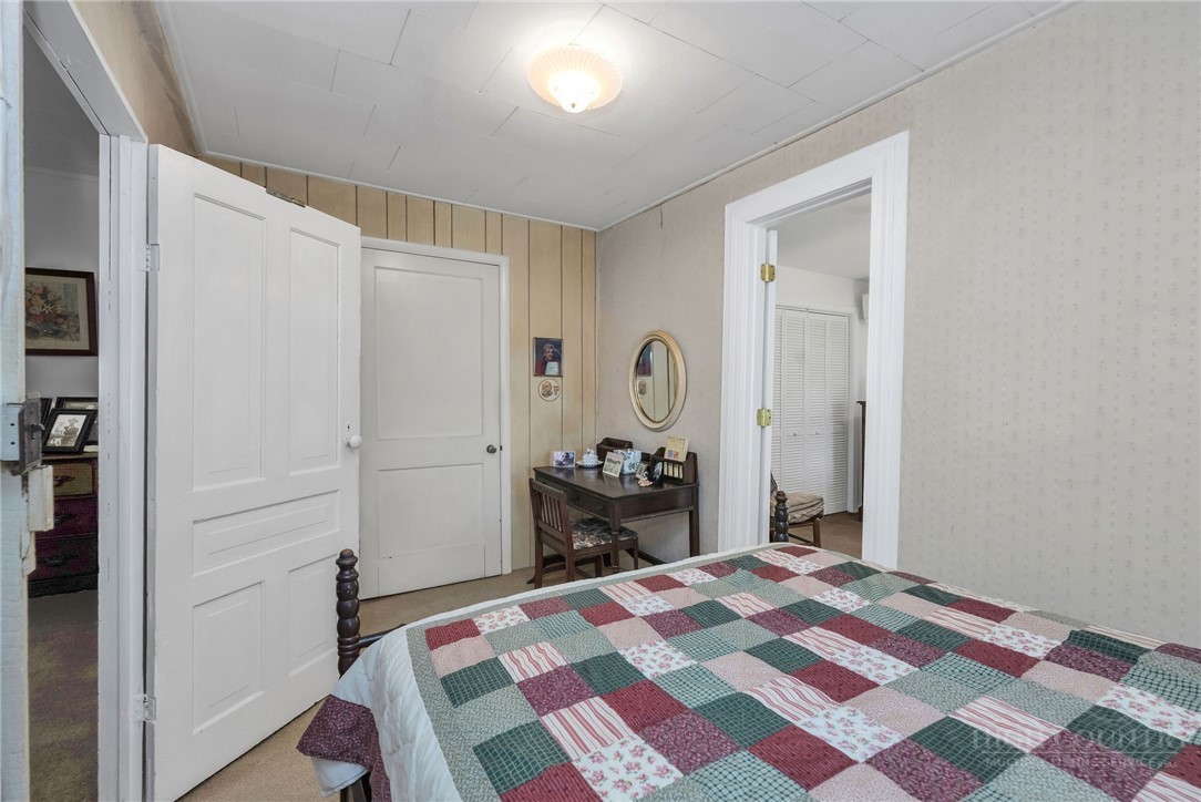 2284 Idlewild Road West Jefferson, NC 28694 - Photo 20 of 23 a bedroom with a bed and a dresser