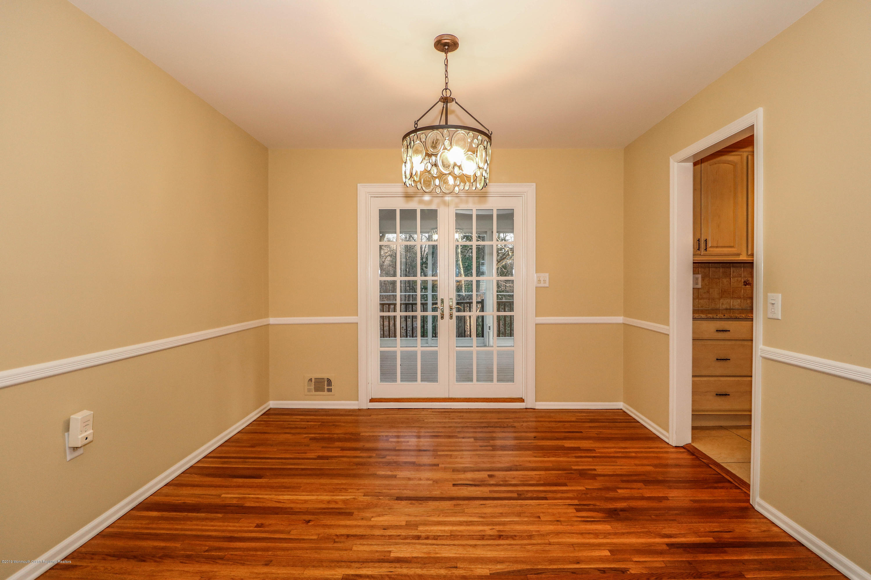 15 Middlebrook Drive Asbury Park, NJ 07712 - Photo 11 of 39 a view of an empty room with wooden floor and a window