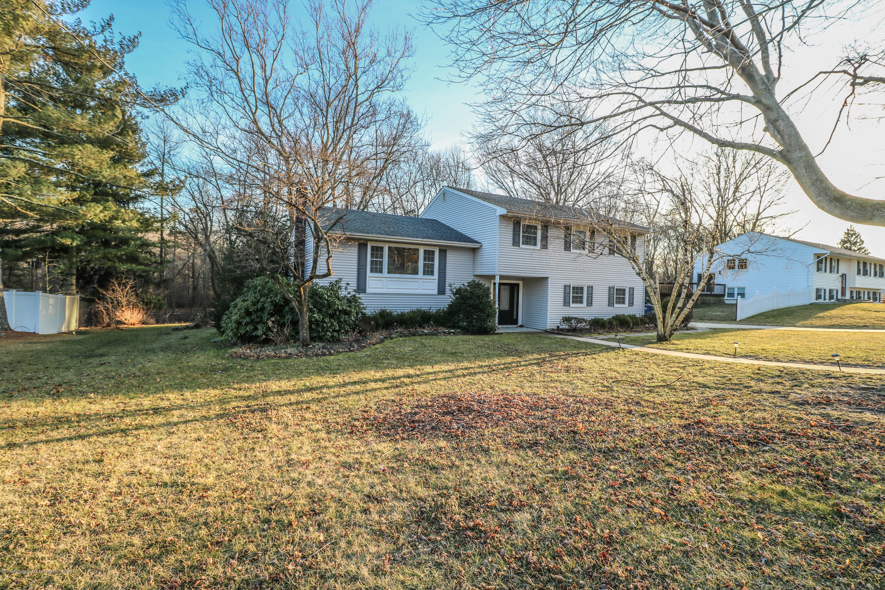15 Middlebrook Drive Asbury Park, NJ 07712 - Photo 2 of 39 a front view of a house with a yard and garage