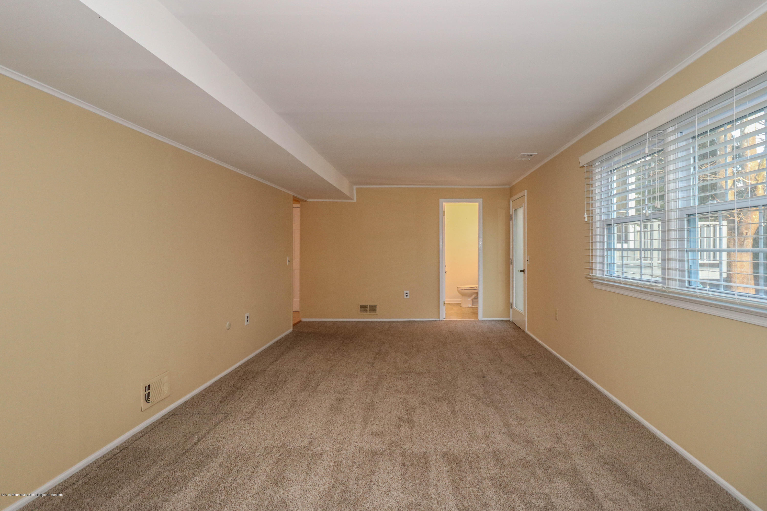 15 Middlebrook Drive Asbury Park, NJ 07712 - Photo 22 of 39 a view of an empty room with a window