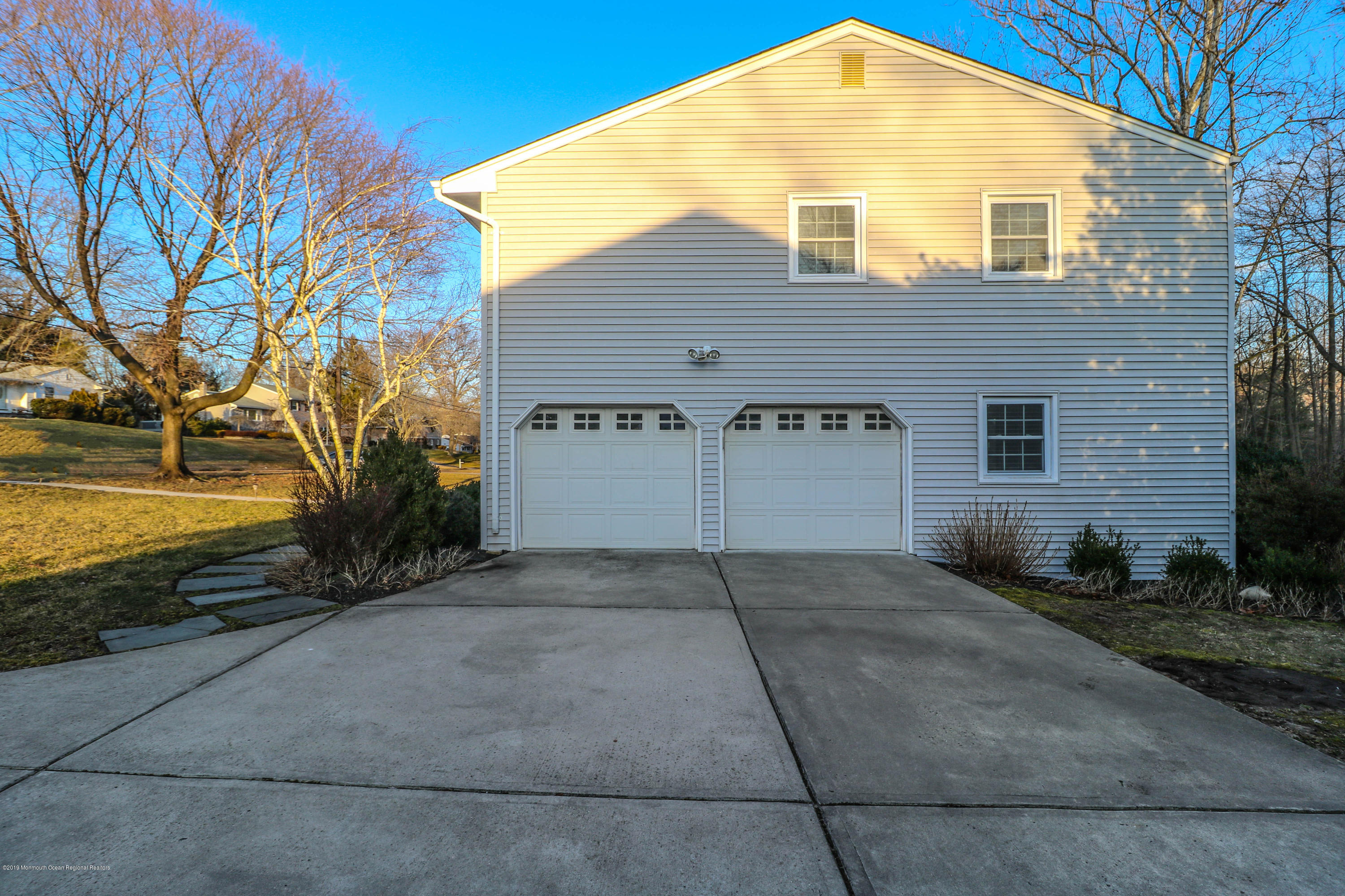 15 Middlebrook Drive Asbury Park, NJ 07712 - Photo 3 of 39 a front view of a house with a yard