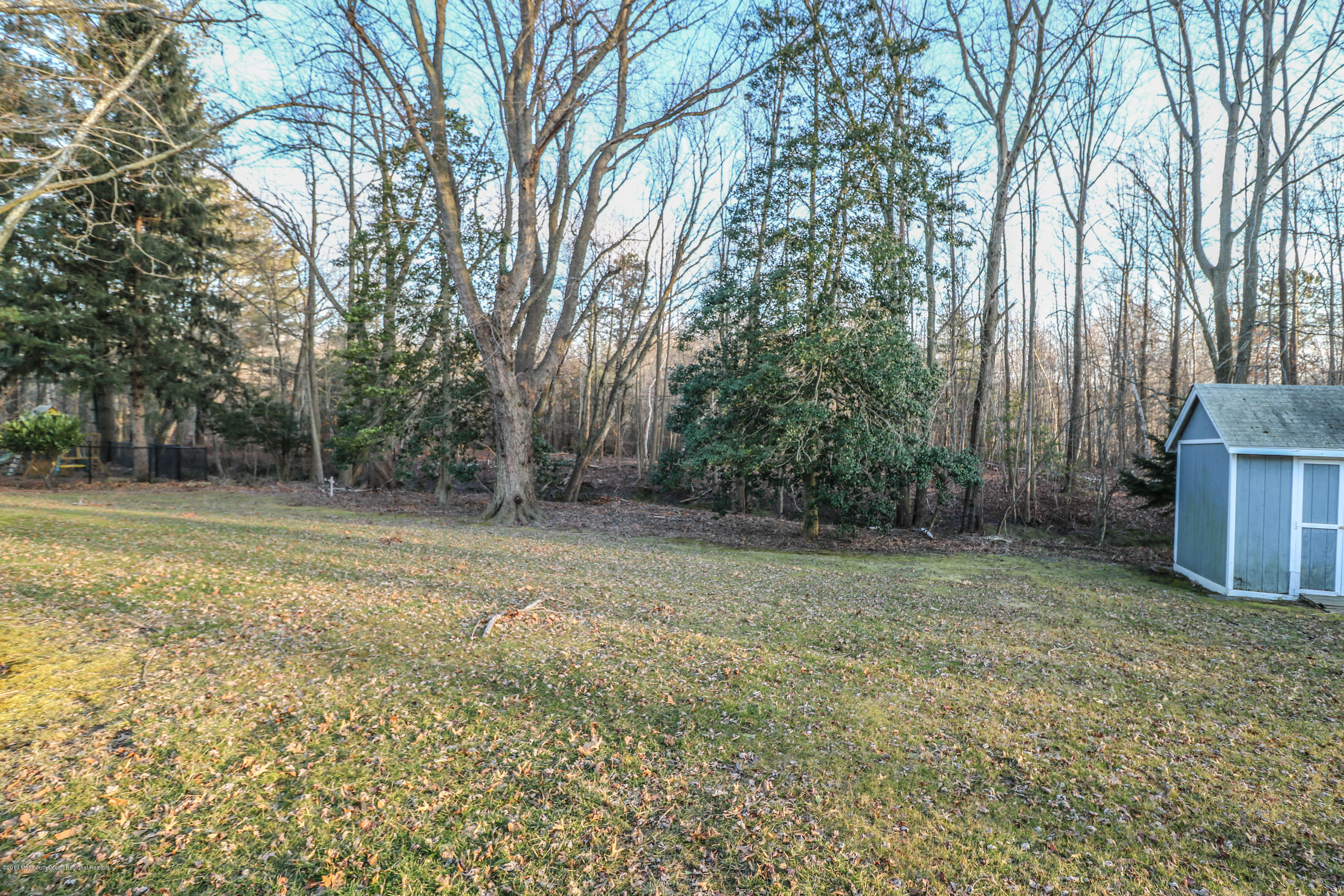 15 Middlebrook Drive Asbury Park, NJ 07712 - Photo 37 of 39 a view of a field with trees in the background