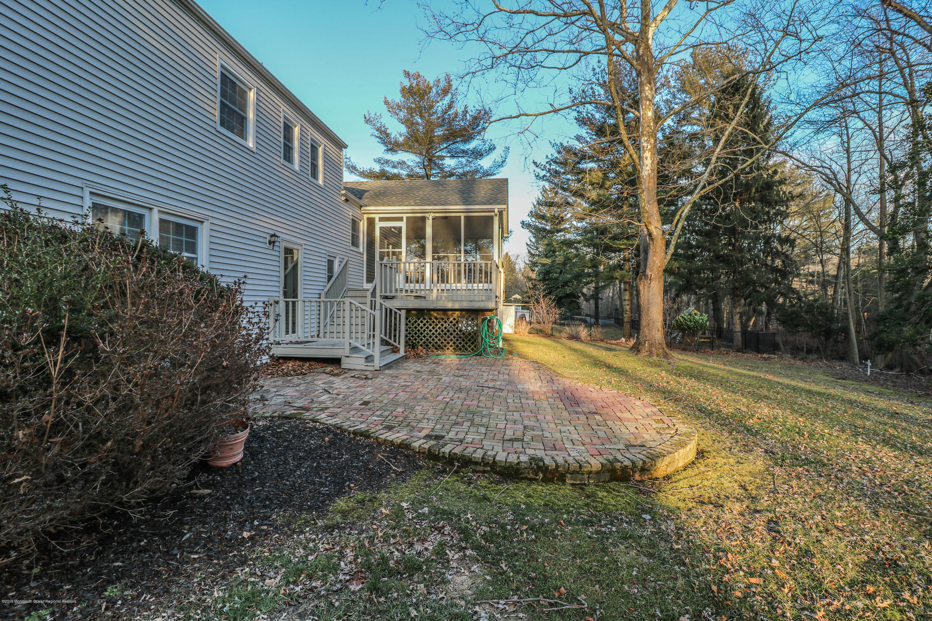 15 Middlebrook Drive Asbury Park, NJ 07712 - Photo 38 of 39 a view of a house with backyard and trees