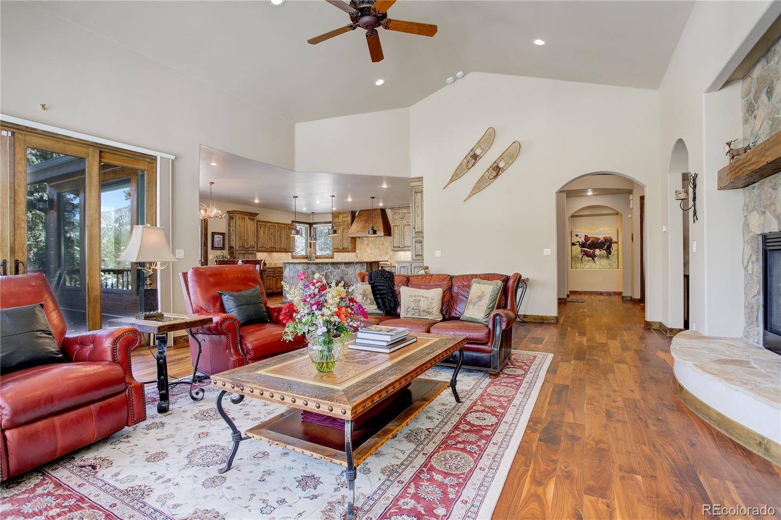 92 Whiskey Jay Hill Road Evergreen, CO 80439 - Photo 11 of 45 a living room with furniture and wooden floor