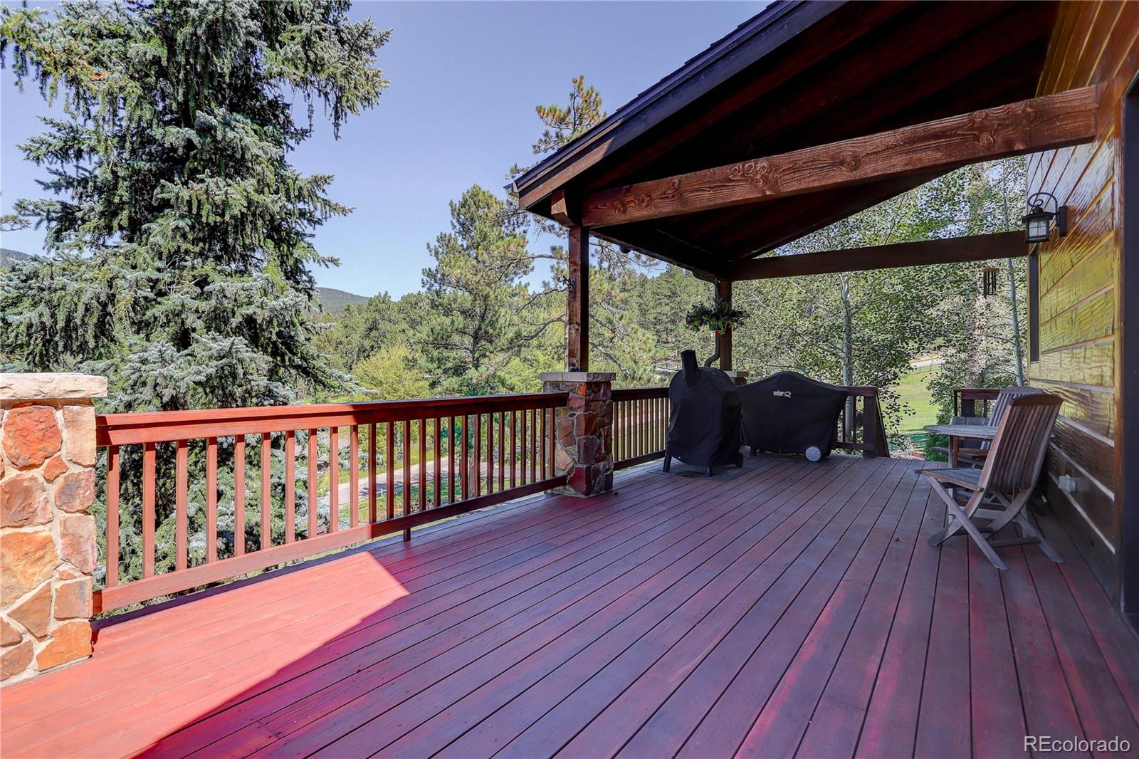 92 Whiskey Jay Hill Road Evergreen, CO 80439 - Photo 14 of 45 a view of porch with seating space