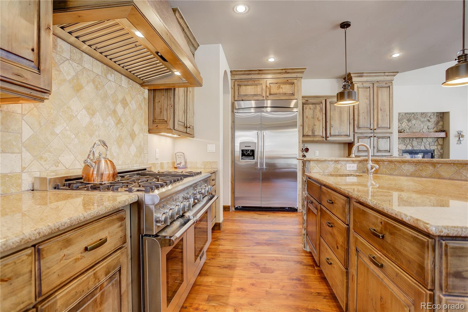 92 Whiskey Jay Hill Road Evergreen, CO 80439 - Photo 17 of 45 a kitchen with a stove and a sink