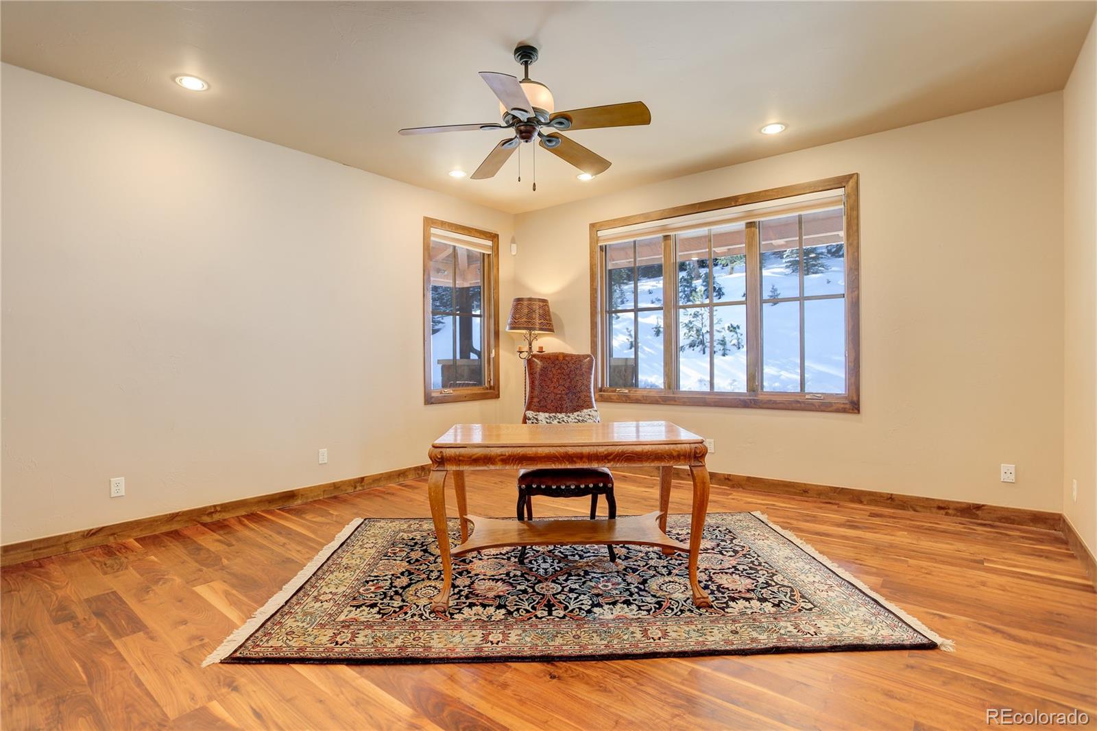 92 Whiskey Jay Hill Road Evergreen, CO 80439 - Photo 18 of 45 a living room with couch and a table