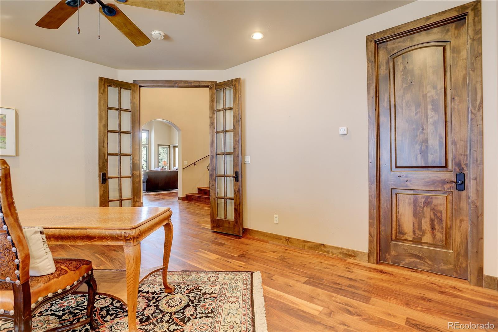 92 Whiskey Jay Hill Road Evergreen, CO 80439 - Photo 19 of 45 a workspace with furniture and window