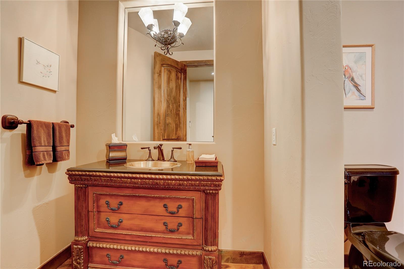 92 Whiskey Jay Hill Road Evergreen, CO 80439 - Photo 20 of 45 a bathroom with a sink and a mirror