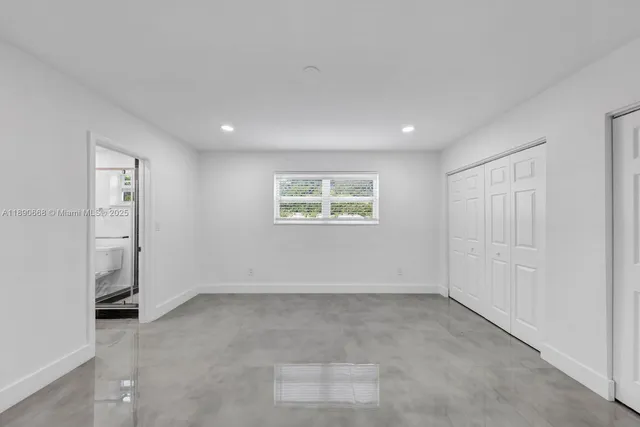 an empty room with windows