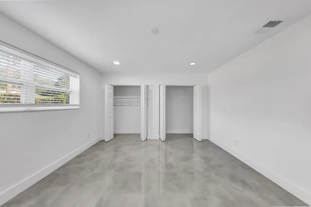 a view of hallway with a large window