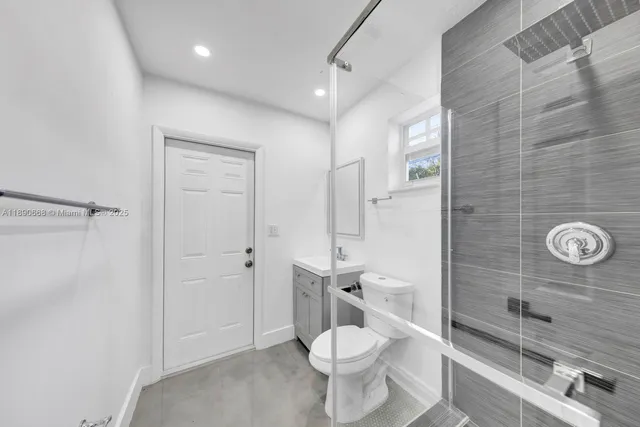 a view of a hallway with a balcony and wooden floor