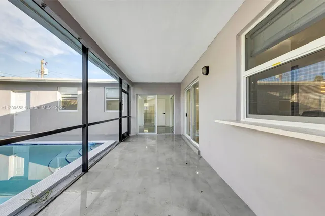 a front view of house with a garden and patio