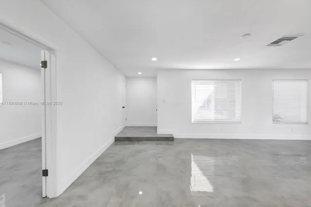 an empty room with windows