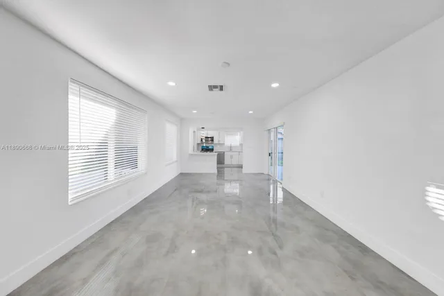 a kitchen with granite countertop a sink and a stove top oven