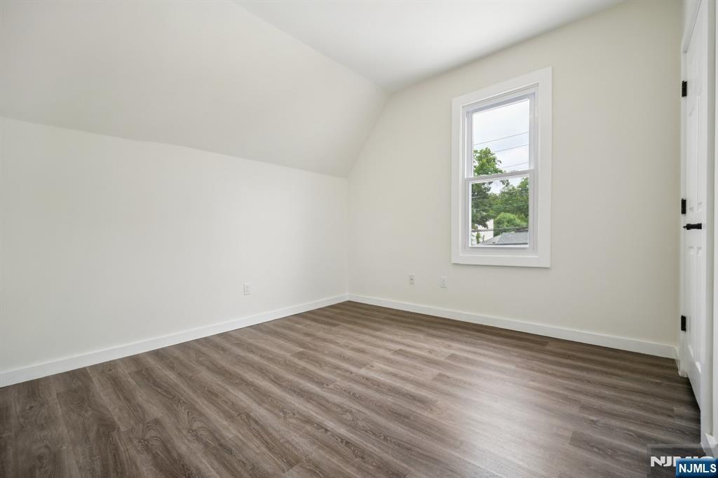 534 Durie Avenue, Unit 3 Closter, NJ 07624 - Photo 15 of 32 an empty room with wooden floor and windows