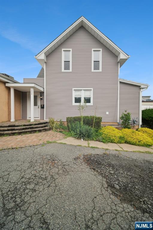 534 Durie Avenue, Unit 3 Closter, NJ 07624 - Photo 2 of 32 a view of a house with backyard and garden