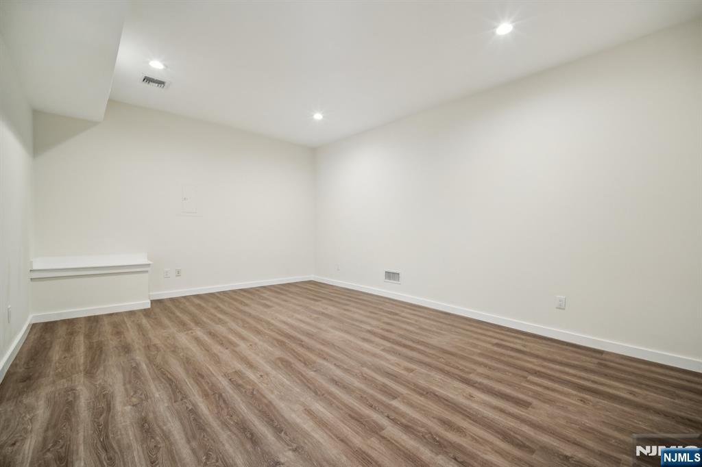 534 Durie Avenue, Unit 3 Closter, NJ 07624 - Photo 27 of 32 a view of a room with wooden floor and white walls