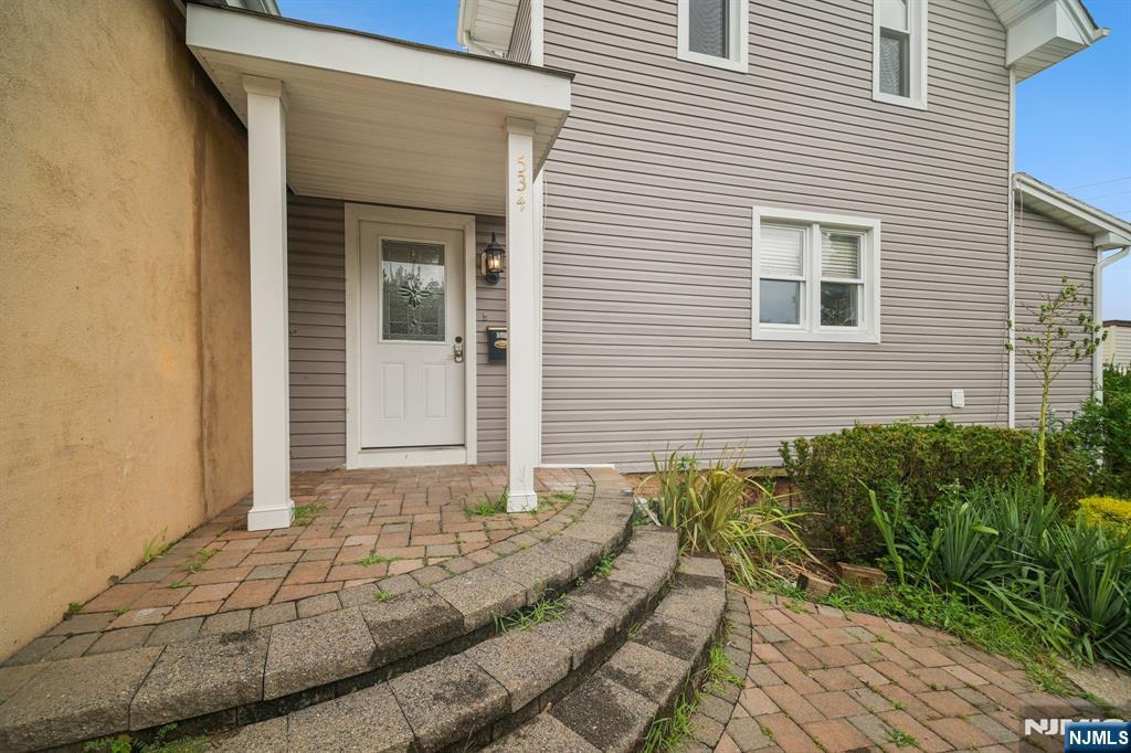 534 Durie Avenue, Unit 3 Closter, NJ 07624 - Photo 5 of 32 a view of a house with a backyard