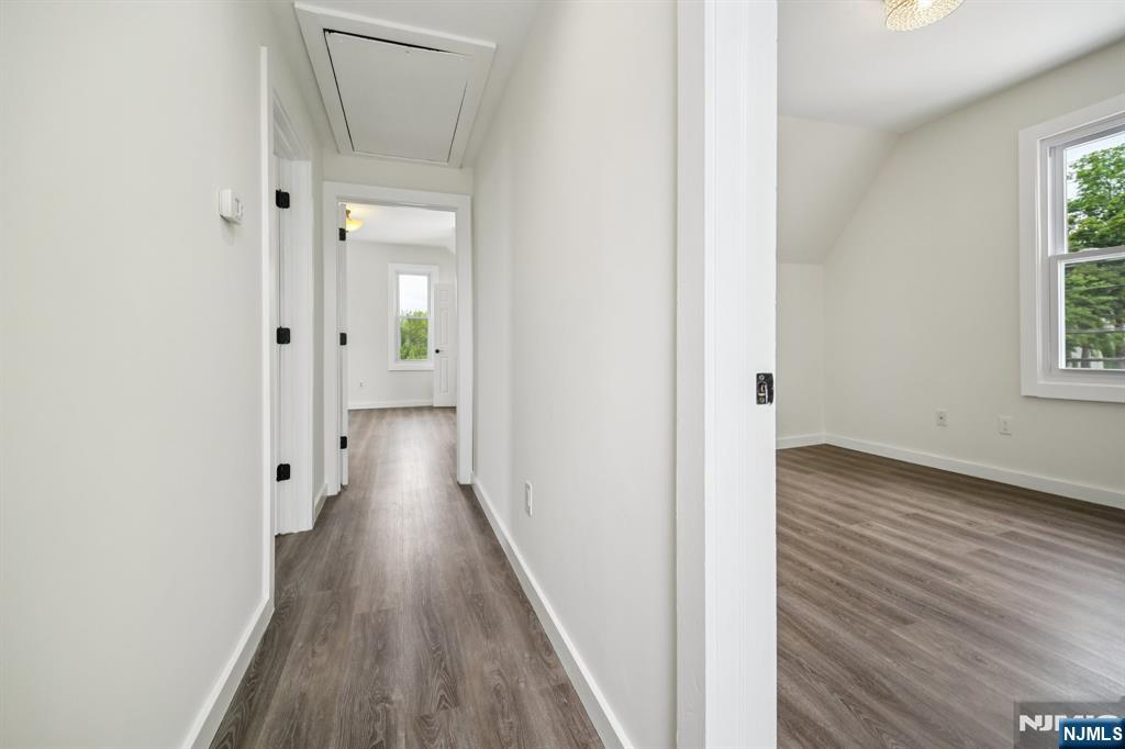 534 Durie Avenue, Unit 3 Closter, NJ 07624 - Photo 8 of 32 a view of a hallway with wooden floor