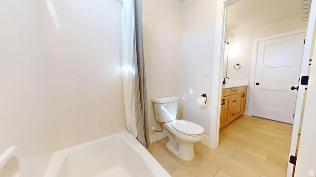 1127 4240 North Enoch, UT 84721 - Photo 44 of 56 Bathroom featuring vanity and shower / tub combo with curtain