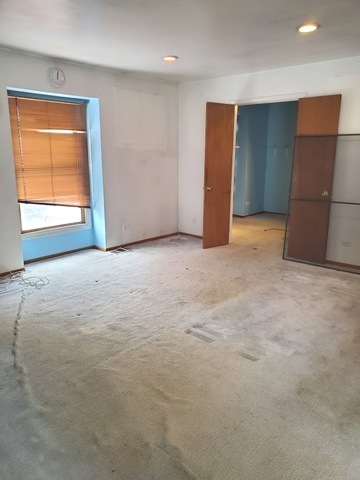 324 Inverrary Lane, Unit D Deerfield, IL 60015 - Photo 12 of 32 a view of an empty room with a closet
