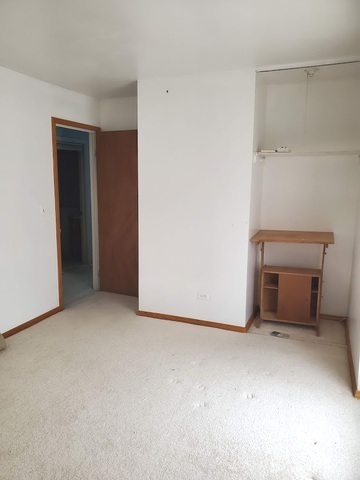324 Inverrary Lane, Unit D Deerfield, IL 60015 - Photo 20 of 32 a view of an empty room with a closet