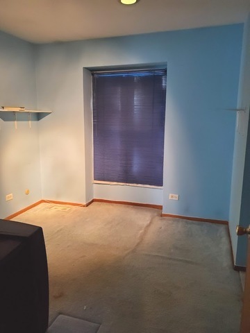 324 Inverrary Lane, Unit D Deerfield, IL 60015 - Photo 22 of 32 a view of an empty room and window