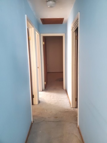 324 Inverrary Lane, Unit D Deerfield, IL 60015 - Photo 26 of 32 a view of a hallway to rooms