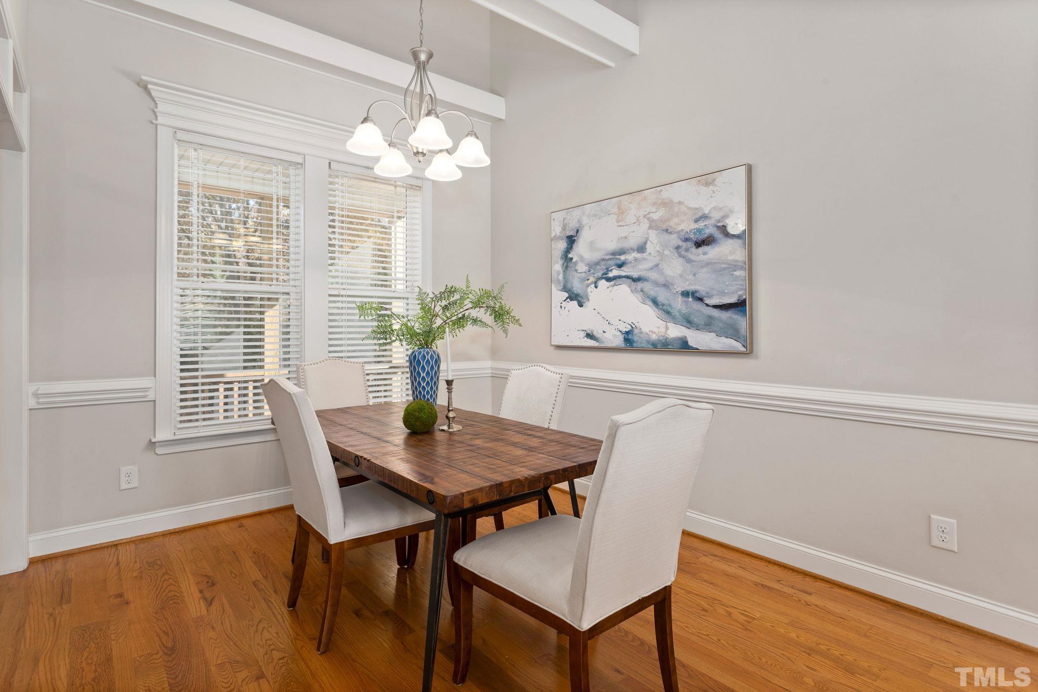 1425 Silver Farm Road Raleigh, NC 27603 - Photo 6 of 23 a view of a dining room with furniture and wooden floor