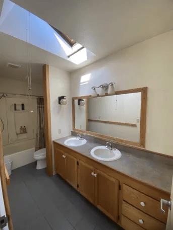 12168 Granite Ridge Road Oroville, CA 95965 - Photo 34 of 34 a spacious bathroom with a granite countertop sink and a mirror