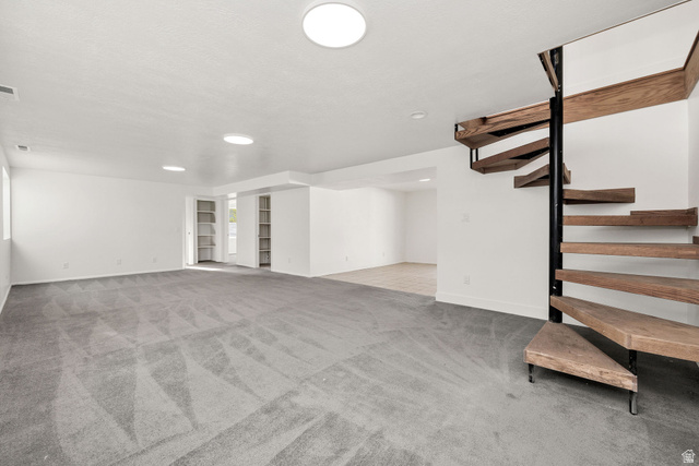 4155 Johnson Road Nibley, UT 84321 - Photo 30 of 71 Finished below grade area with light carpet and built in features