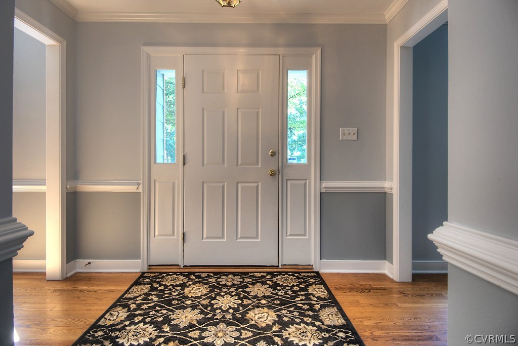 15218 Powell Grove Road Midlothian, VA 23112 - Photo 3 of 35 Welcoming foyer with hardwood floors, moulding, an
