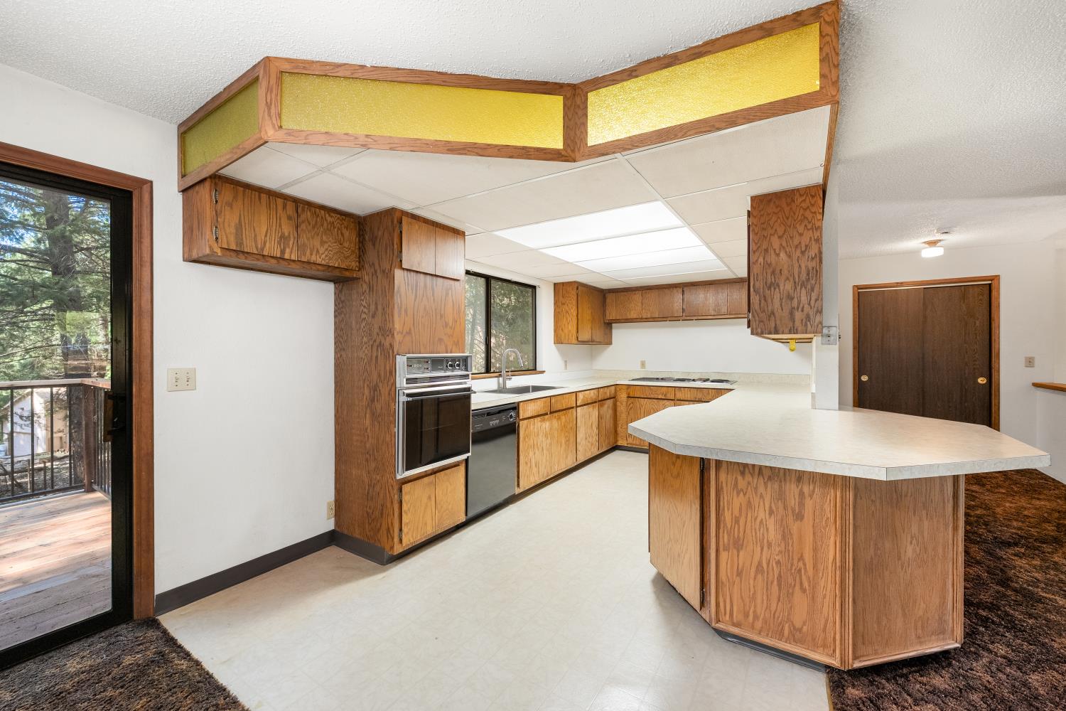 22945 Foresthill Road Foresthill, CA 95631 - Photo 15 of 63 a kitchen with stainless steel appliances granite countertop a sink and a refrigerator