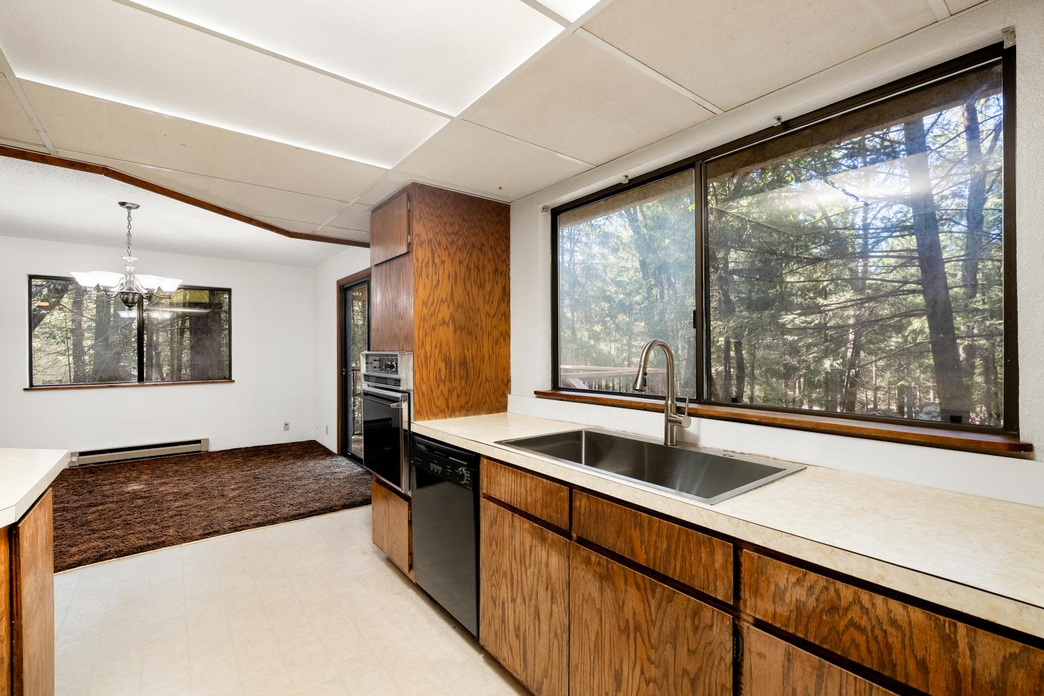 22945 Foresthill Road Foresthill, CA 95631 - Photo 16 of 63 a kitchen with stainless steel appliances granite countertop a sink and a large window
