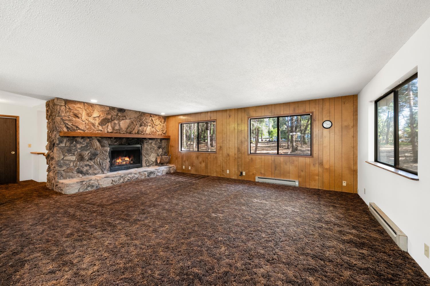 22945 Foresthill Road Foresthill, CA 95631 - Photo 18 of 63 a view of empty room with fireplace and window
