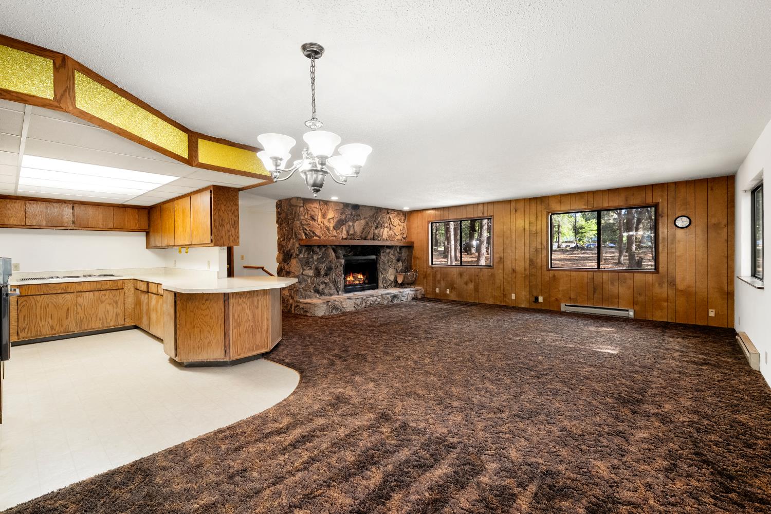 22945 Foresthill Road Foresthill, CA 95631 - Photo 22 of 63 a living room with furniture and a chandelier