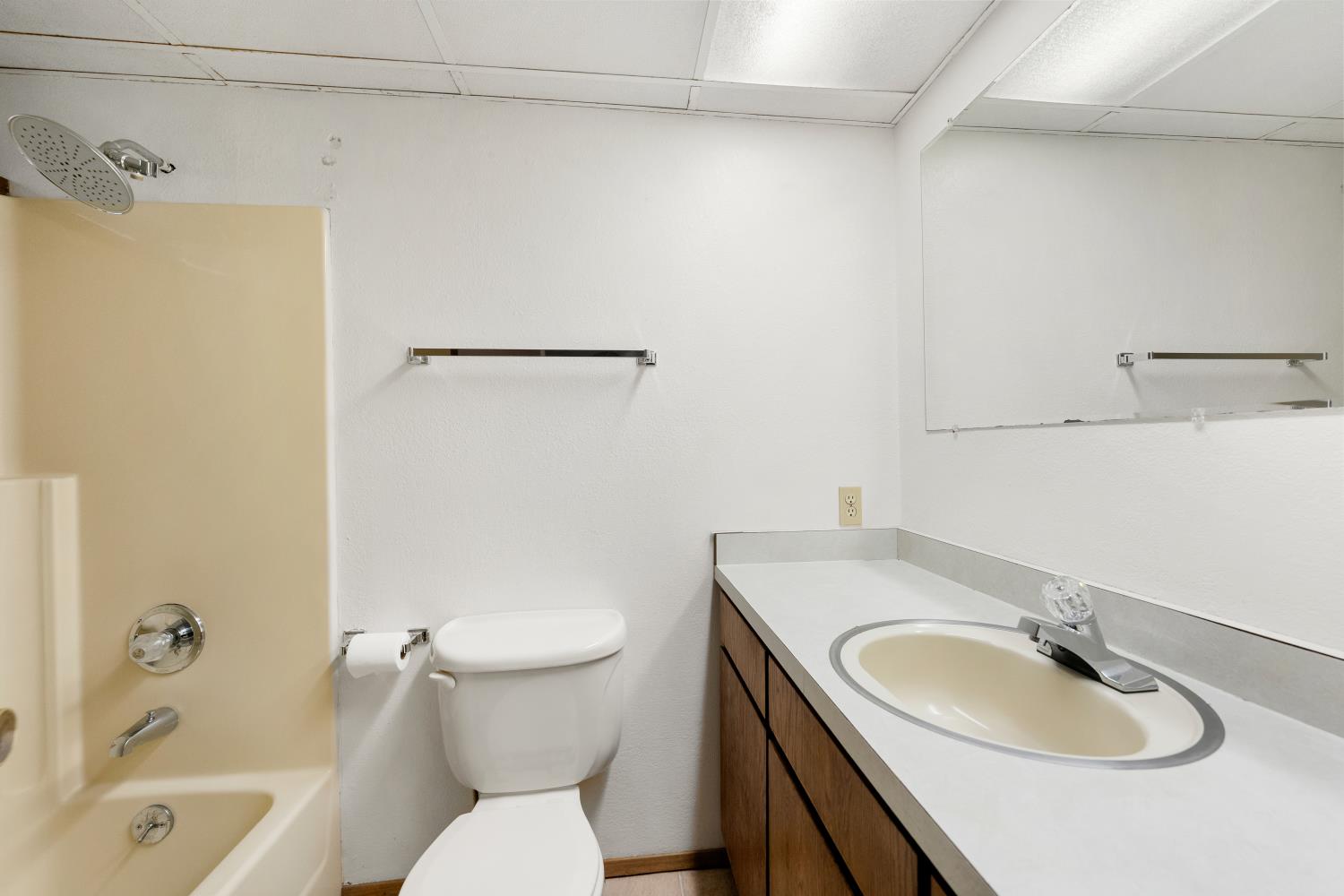 22945 Foresthill Road Foresthill, CA 95631 - Photo 32 of 63 a bathroom with a granite countertop sink toilet a mirror and shower