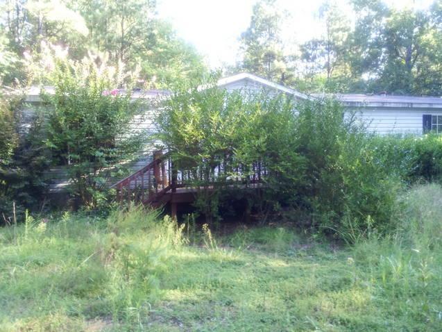 219 Thomas Ferry Road Jackson, GA 30233 - Photo 1 of 1 a backyard of a house with lots of green space and mountain view